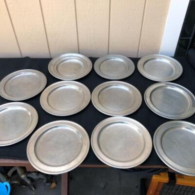 Lot 35P. 9 Pewter plates/chargers: 6 Woodbury Pewter, made in England; 3 unbranded â€” $25