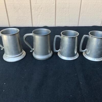Lot 42P. 4 Pewter tankards: 2 glass bottoms, unbranded; 2 Leonard Eagles Sheffield since 1779, made in England, glass bottomsâ€” $20