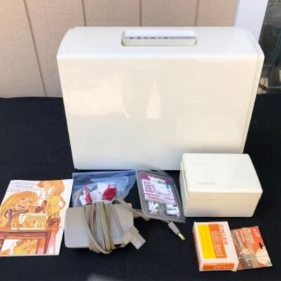 Lot 51L. Vintage Singer Sewing Machine Touch and Sew II Model 775,  in case with box of attachments and bag of sewing notions, and works...