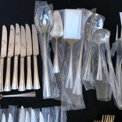 Lot 63L. Reed & Barton Stainless Flatware, Brookshire pattern, New and Unused, 115 Pieces â€” $225