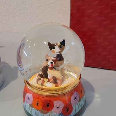 Lot 150: Goebel Cat Water Globe and Magnetic Skating Penguin Music Box 