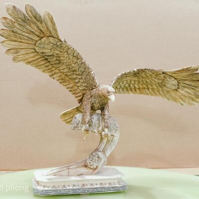 Bone Sculpture - An eagle swooping down to snatch a fish
