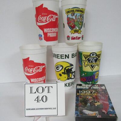 4 Plastic Green Bay Packers & 1 College Football 1988 Pizza Hut Cups and 1 Sealed Sports Illustrated 1997 VHS