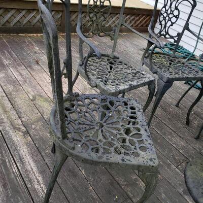 Heavy iron patio table and 4 chairs 