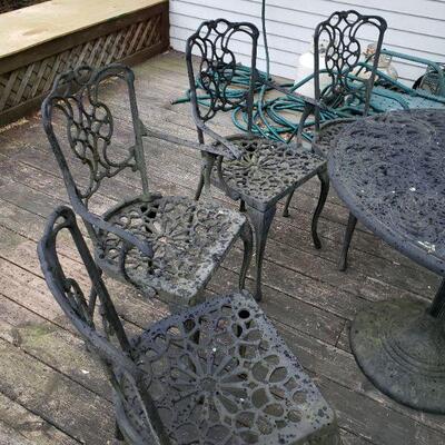 Heavy iron patio table and 4 chairs 