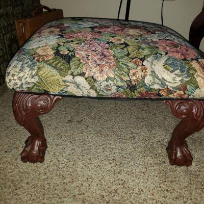 Antique footstool with floral fabric