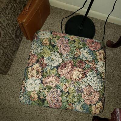 Antique footstool with floral fabric