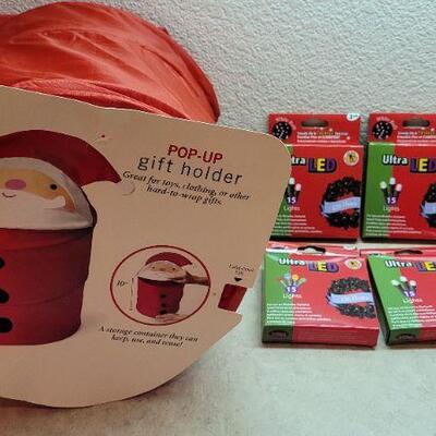 Lot 290: New ULTRA LED Light Packs (4) an Pop Up Christmas Gift Holder