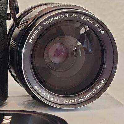 Lot 326: Vintage KONICA 35MM Lens F2.8 w/ Case