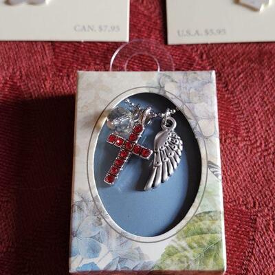 Lot 361: New Hallmark Boy & Girl Charm and Cross and Angel Wing Necklace