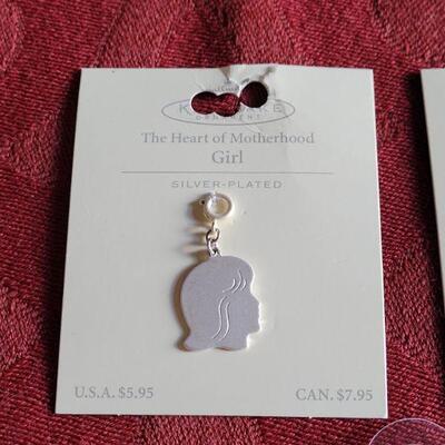 Lot 361: New Hallmark Boy & Girl Charm and Cross and Angel Wing Necklace