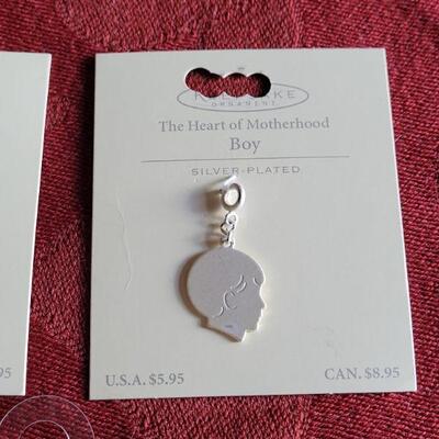 Lot 361: New Hallmark Boy & Girl Charm and Cross and Angel Wing Necklace