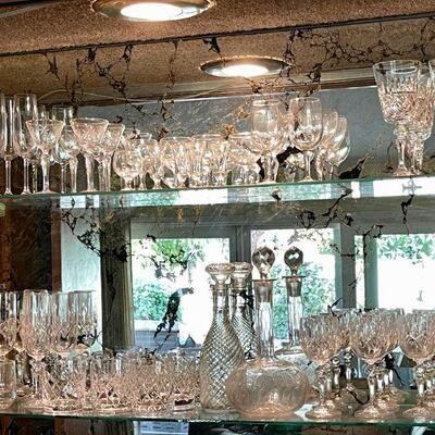 Lot 156 Two Shelves of Crystal Bar Glasses Decanters Various Sizes 