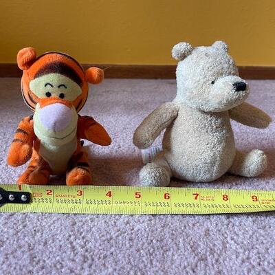 2 small Winnie the Pooh plush toys