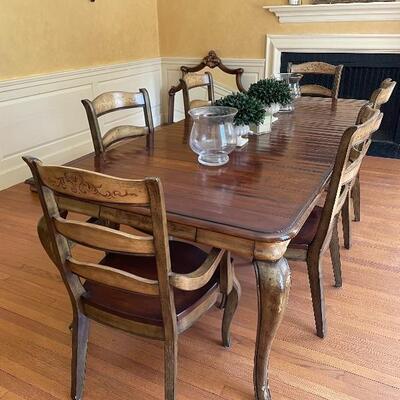 Like new Hooker dining table with six chairs. 