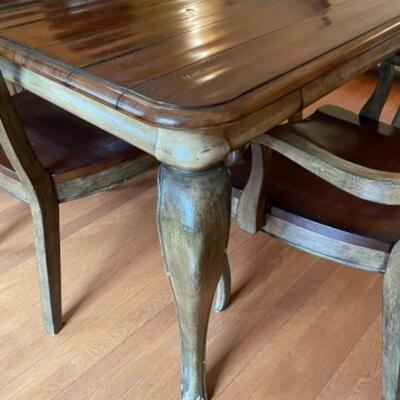 Like new Hooker dining table with six chairs. 