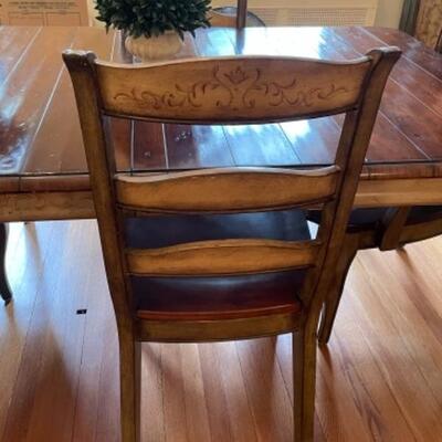 Like new Hooker dining table with six chairs. 