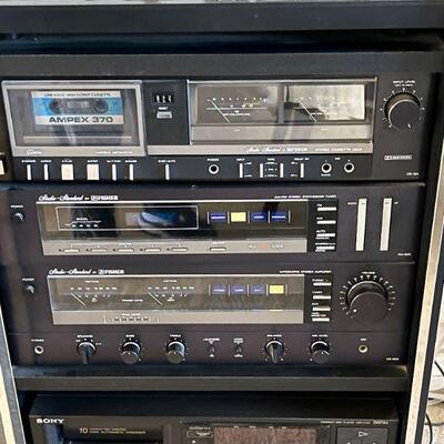 Lot 207  Fisher Stereo System in Cabinet Turntable Cassette Player AMFM Synthesizer Receiver & Floor Speakers 