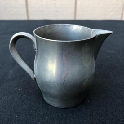Lot 33P. 4 Pewter pitchers in various sizes â€” $18.75
