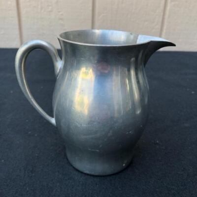 Lot 33P. 4 Pewter pitchers in various sizes â€” $18.75