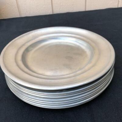 Lot 35P. 9 Pewter plates/chargers: 6 Woodbury Pewter, made in England; 3 unbranded â€” $12.50