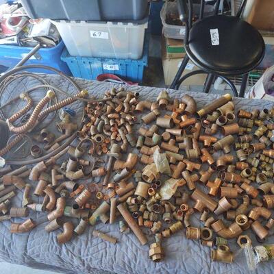LOT 74 - Copper and brass fittings - over 150 pieces - in bins