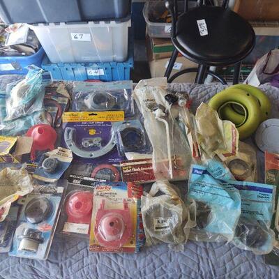 LOT 79 - New in package, Assorted plumbing - flapper, flange, assembly, valve, etc. ON TABLE TOP
