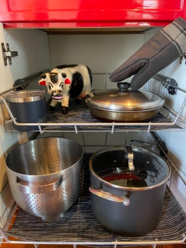 Lot 103K. Emeril stock pot, colander, papier mache cow, oven mitt, placemats—45