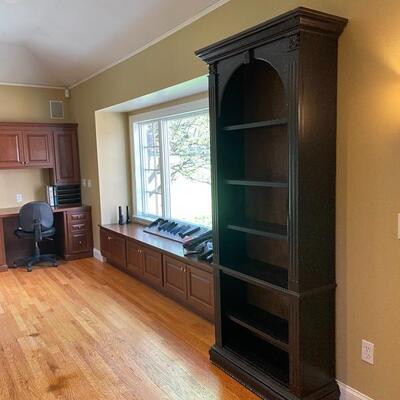 Beautiful bookshelf with subtle hand painting detail 