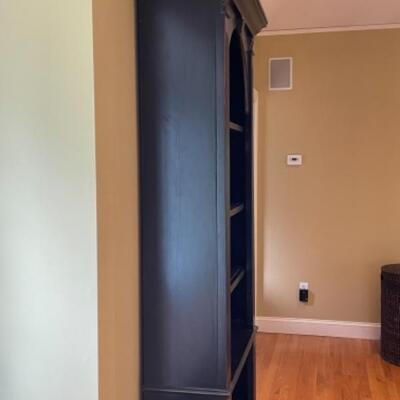Beautiful bookshelf with subtle hand painting detail 
