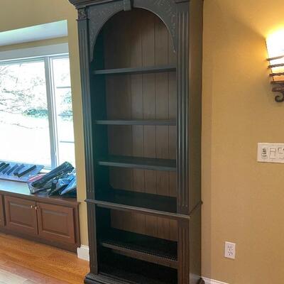 Beautiful bookshelf with subtle hand painting detail 