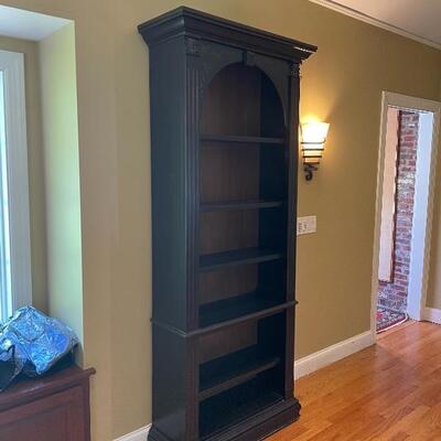 Beautiful bookshelf with subtle hand painting detail 