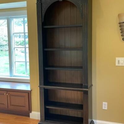 Beautiful bookshelf with subtle hand painting detail 