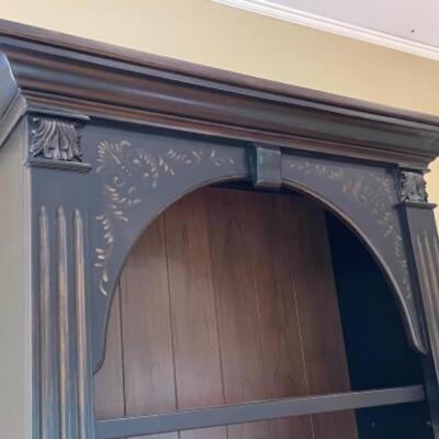 Beautiful bookshelf with subtle hand painting detail 