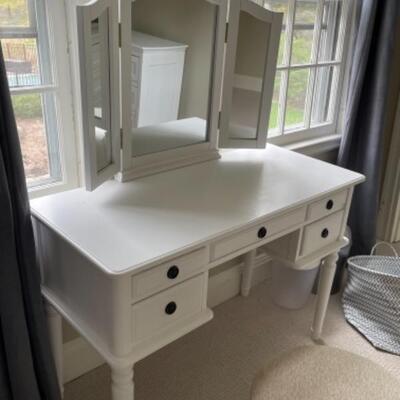 White vanity with mirror and stool