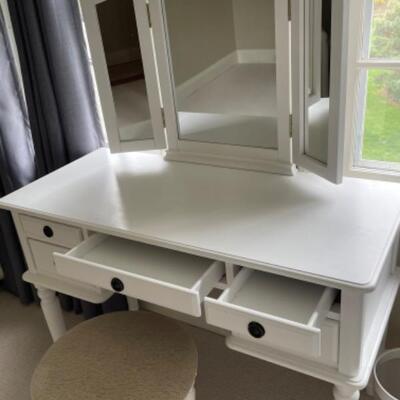 White vanity with mirror and stool