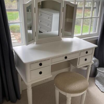 White vanity with mirror and stool
