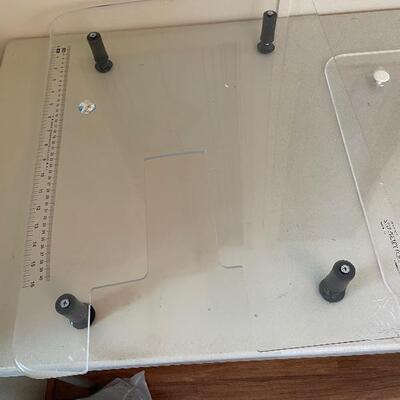 Two sewing machine work surfaces