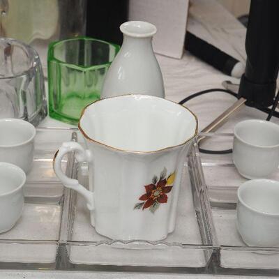 Lot 17- Flask holder portable shot glasses, trays, Sake set.