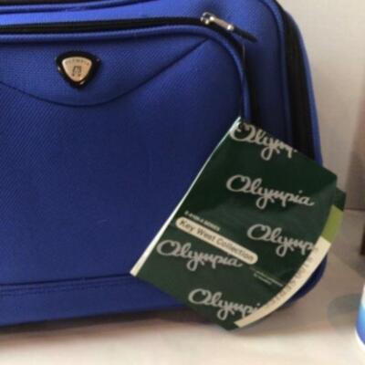 P363 New with tag Olympia Carry On Travel Bag with REDKEN Products  