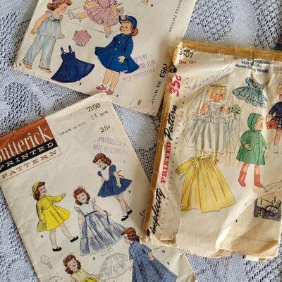 Lot 105: Assorted Vintage Doll Printed Sewing Patterns 