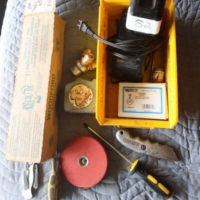 LOT 82 - Freezeless wall faucet, tape measure, screw drivers, box cutter, pocket knife, watter pressure test gauge, battery charger, etc....