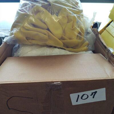 lot 107  - Box of yellow rubber gloves, white disposable coveralls, etc