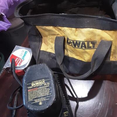 lot 140 -SDewalt battery and charger,  saw blades in toolbag as shown