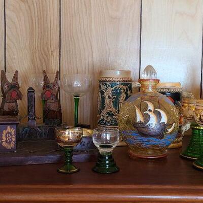 Lot 152: Steins, Ship Decanter, German Wood Carved Ashtray Set and More