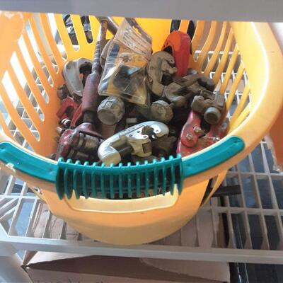 lot 168 Assorted clamps, grips, etc in yellow basket