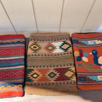 Lot 7LD. Three assorted folk art pillows sizes left to right:  19 1/2â€L x 13â€W,  20 1/2â€L x 15â€W,  19â€L x 14 1/2â€Wâ€”$75