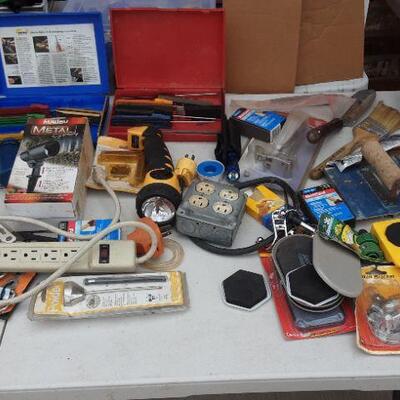 lot 172 Gray Bin/contents as shown - flashlights, furniture movers, spade, knife sharpening kit, multisand, paintbrushes, etc.