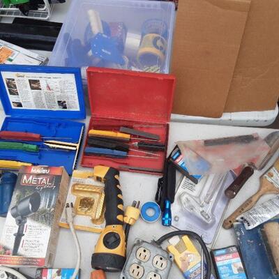 lot 172 Gray Bin/contents as shown - flashlights, furniture movers, spade, knife sharpening kit, multisand, paintbrushes, etc.