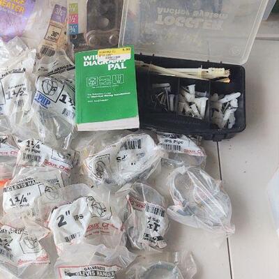 lot 198 - assorted plumbing parts in original packaging - galvanized clevis hangers, gas log part, etc.